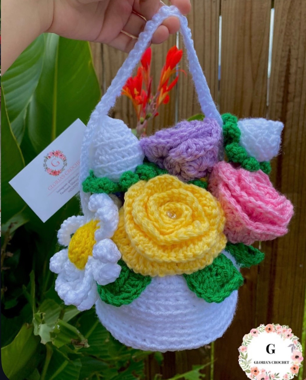 White crochet basket with yellow, pink and lavender flowers