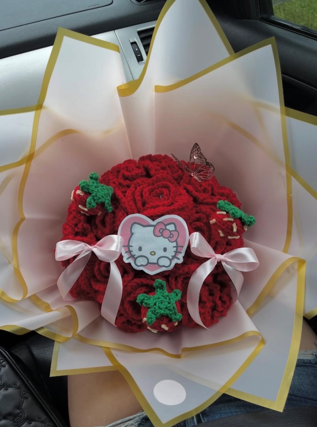 Red crochet rose bouquet with Hello Kitty and strawberry details