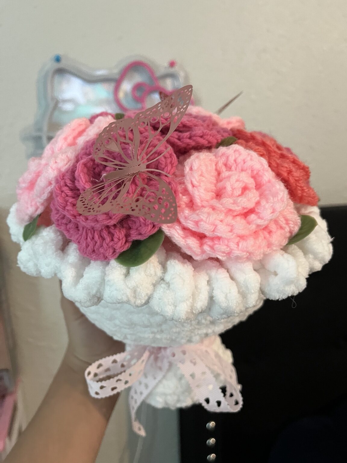 White and pink crochet flower bouquet with butterfly