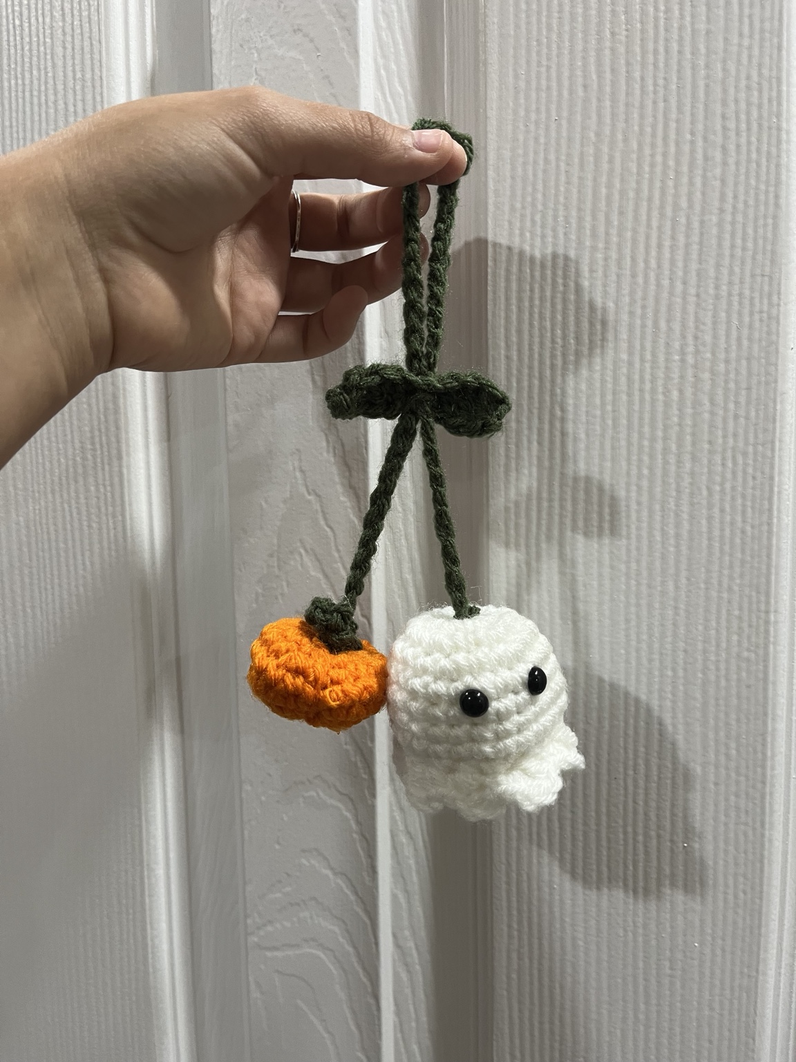 Small spooky crochet ghost and pumpkin car mirror hanger