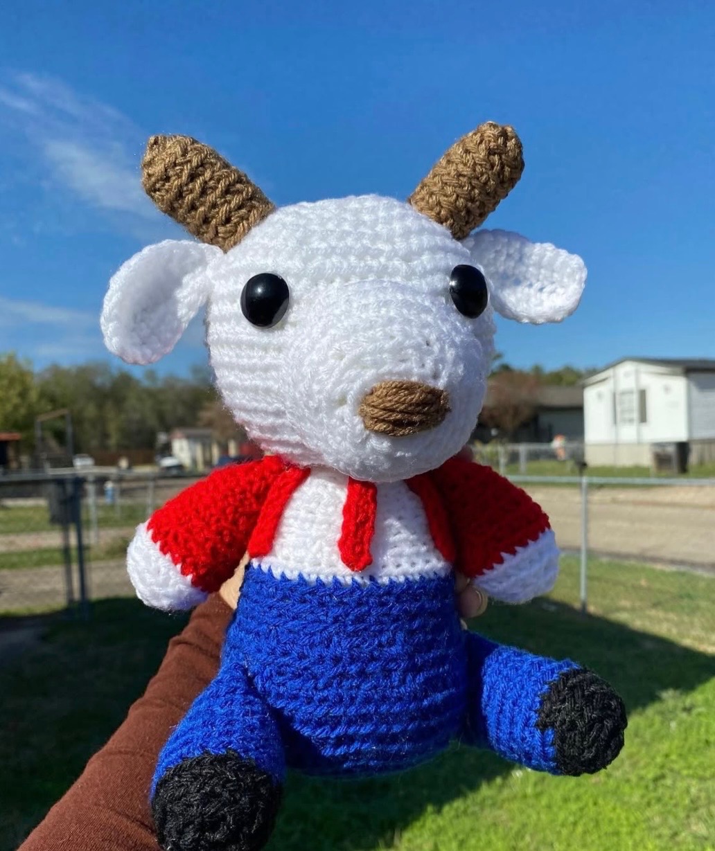 White reindeer crochet character plushie in red and blue