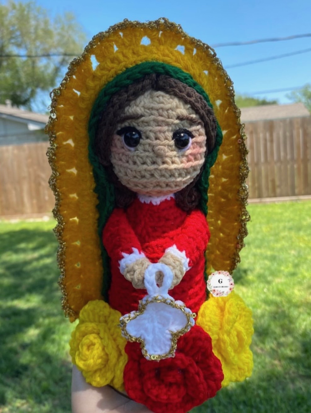 Religious crochet character plushie with gold halo and red dress