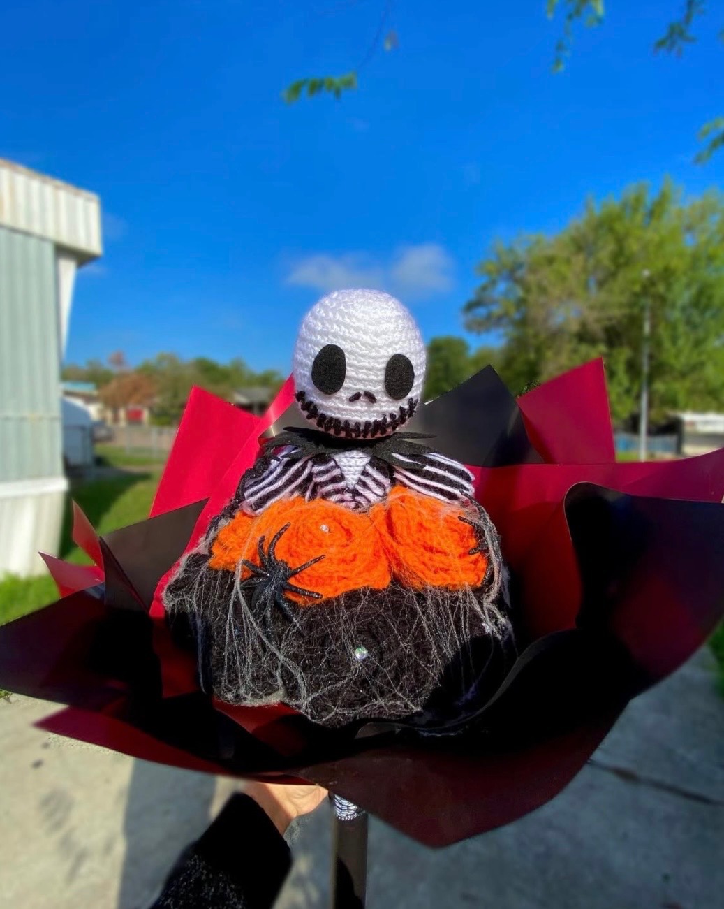 Fall skeleton bouquet with orange and black flowers and decorative diamonds