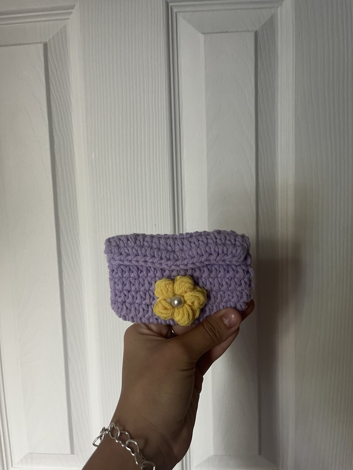 Extra Small lavender crochet bag with a yellow flower and pearl center