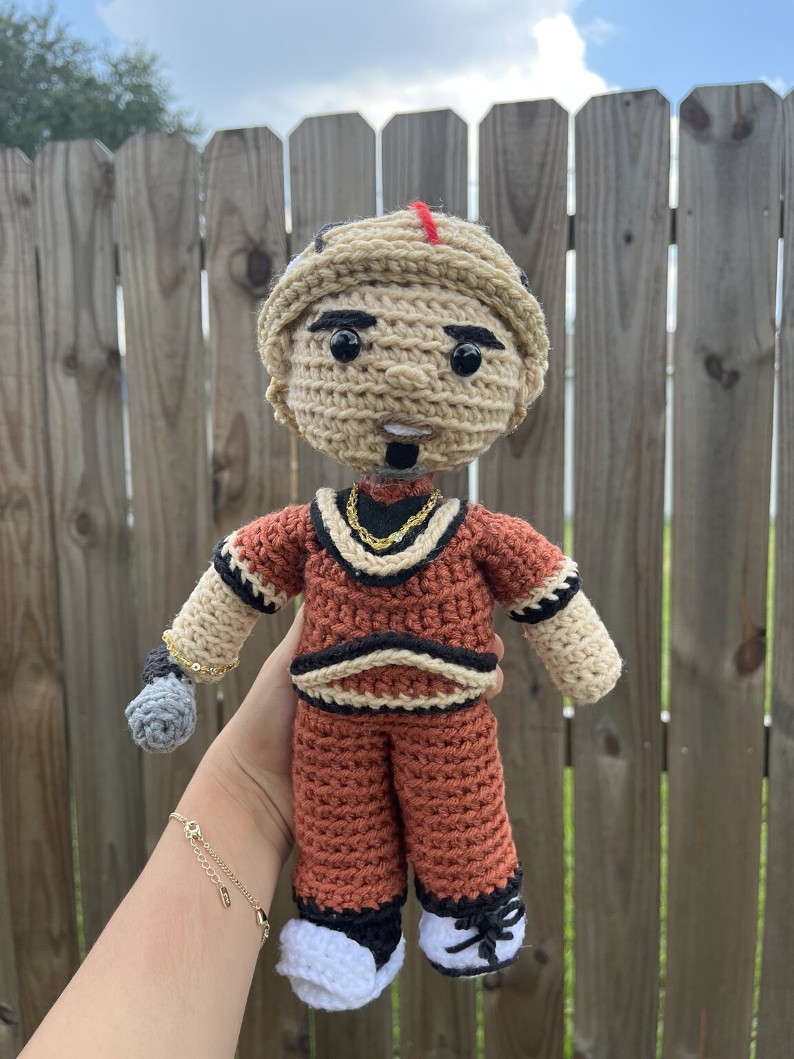 Orange and black crochet character plushie